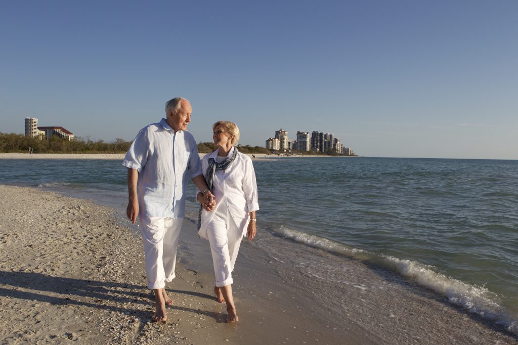 our residents enjoying a stroll on our private beach in Naples